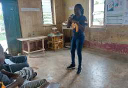 Ms. Janet Addo educating trainees on the need for record keeping and savings Image