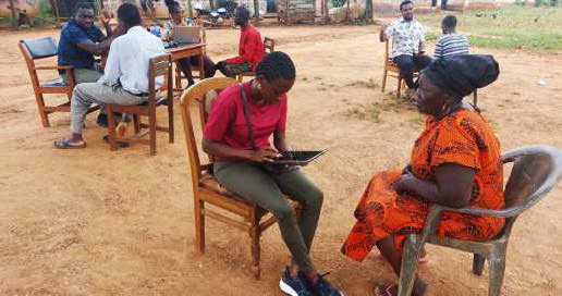 Interviewing coffee farmers in Adomfe using an<br/> online M&E questionnaire Image